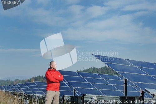 Image of Male solar panel engineer at work place