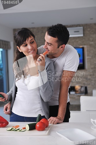 Image of young couple have fun in modern kitchen