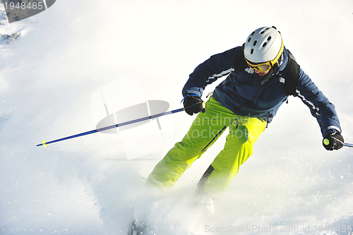 Image of skiing on fresh snow at winter season at beautiful sunny day