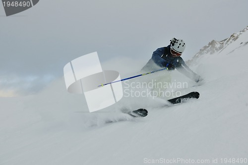 Image of skiing on fresh snow at winter season at beautiful sunny day