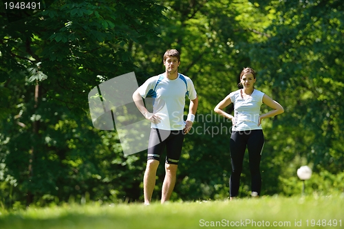 Image of Young couple jogging