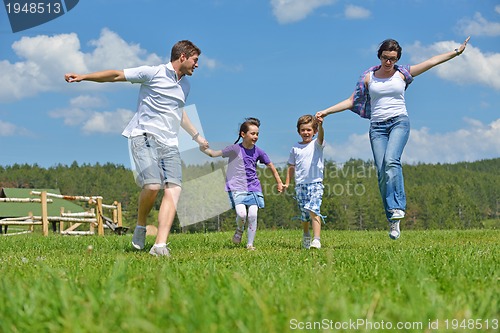 Image of happy young family have fun outdoors