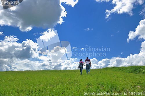 Image of Portrait of romantic young couple smiling together outdoor