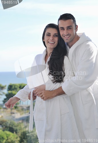 Image of couple relaxing on balcony
