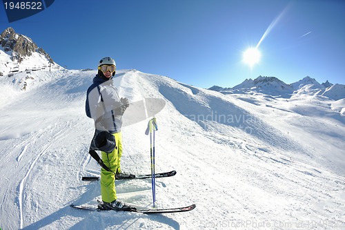 Image of skiing on fresh snow at winter season at beautiful sunny day