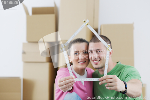 Image of Young couple moving in new house