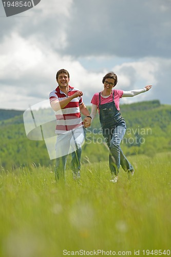 Image of romantic young couple in love together outdoor