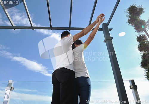 Image of couple relaxing on balcony