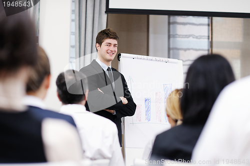 Image of Young  business man giving a presentation on conference