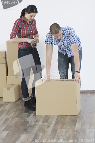 Image of Young couple moving in new home