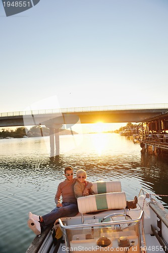 Image of couple in love  have romantic time on boat