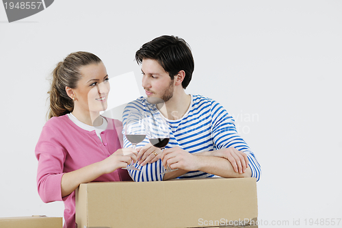 Image of Young couple moving in new house