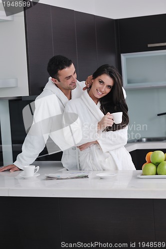 Image of young couple have fun in modern kitchen