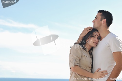 Image of couple relaxing on balcony