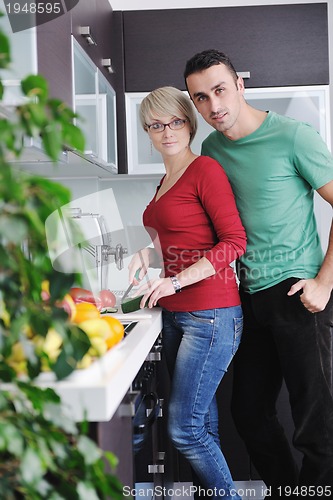 Image of young couple have fun in modern kitchen