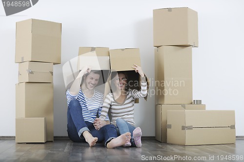 Image of Young couple moving in new home