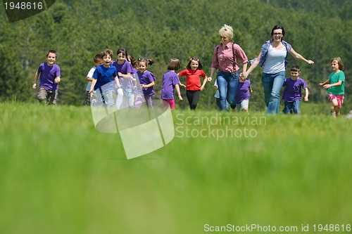 Image of happy kids group  have fun in nature