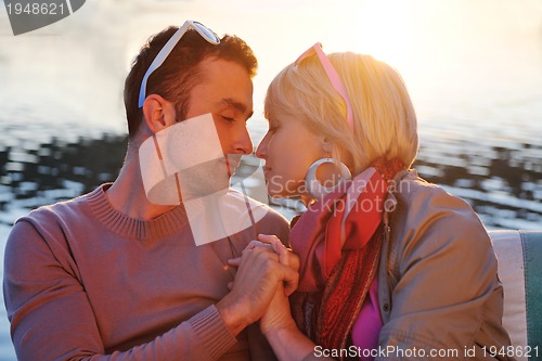 Image of couple in love  have romantic time on boat