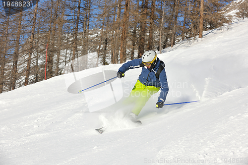 Image of skiing on fresh snow at winter season at beautiful sunny day