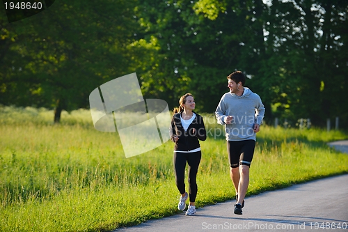 Image of Young couple jogging