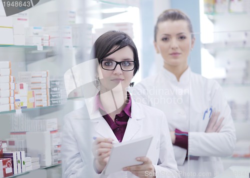Image of team of pharmacist chemist woman  in pharmacy drugstore