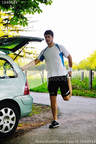 Image of Couple doing stretching exercise  after jogging