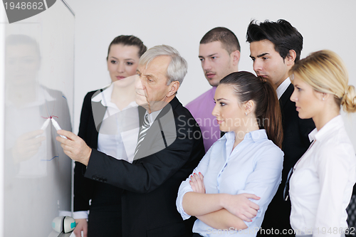 Image of Senior business man giving a presentation