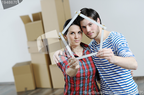 Image of Young couple moving in new house