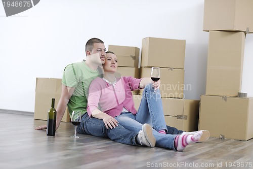 Image of Young couple moving in new home