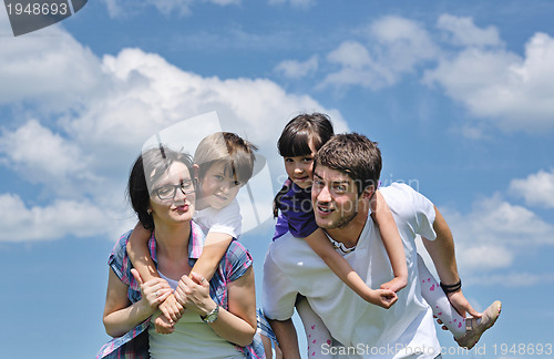 Image of happy young family have fun outdoors