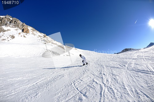 Image of skiing on fresh snow at winter season at beautiful sunny day