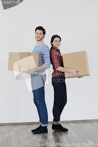 Image of Young couple moving in new home