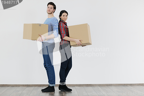 Image of Young couple moving in new home