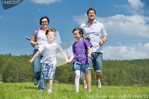 Image of happy young family have fun outdoors