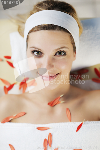 Image of Beautiful young woman in spa