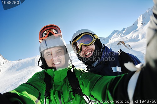 Image of winter portrait of friends at skiing