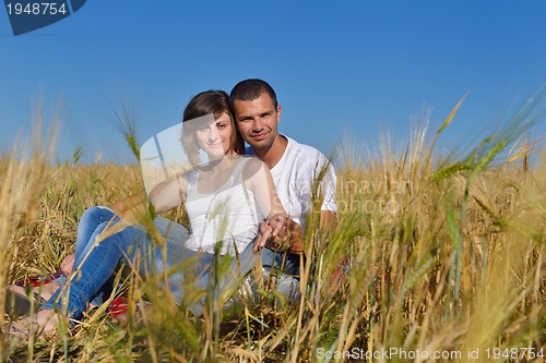 Image of happy couple in wheat field