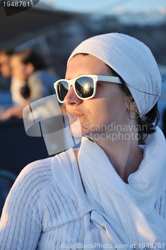 Image of Greek woman on the streets of Oia, Santorini, Greece