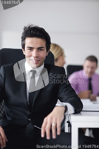 Image of young business man at meeting