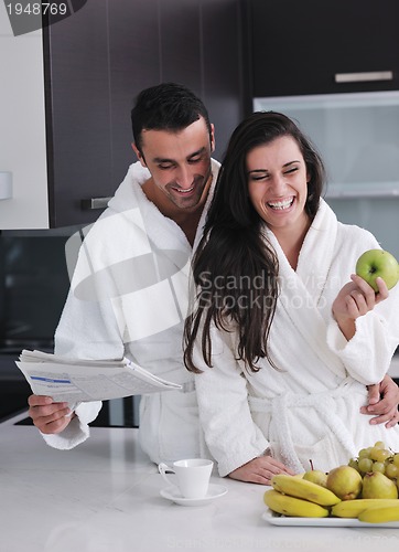 Image of young couple have fun in modern kitchen