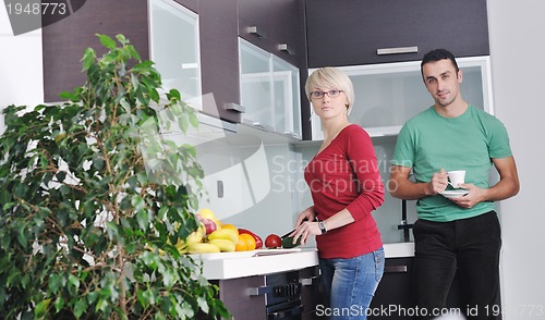 Image of young couple have fun in modern kitchen