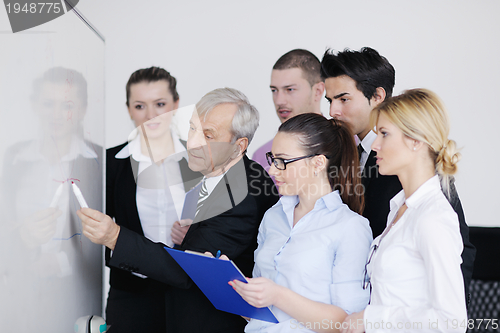 Image of Senior business man giving a presentation