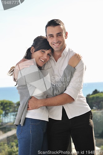 Image of couple relaxing on balcony