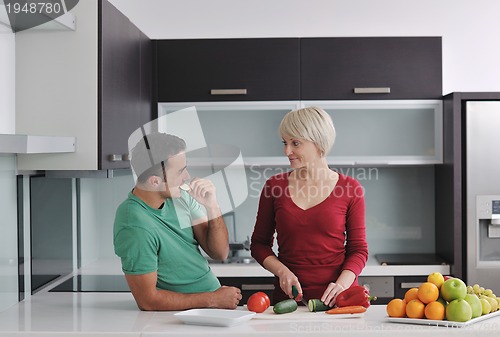 Image of young couple have fun in modern kitchen