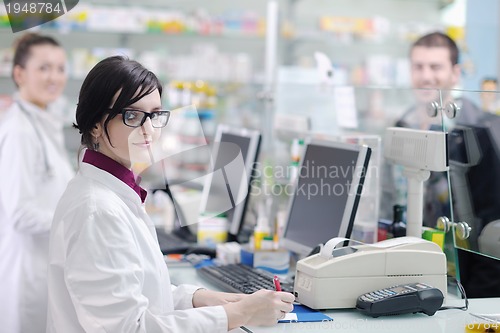 Image of pharmacist suggesting medical drug to buyer in pharmacy drugstor