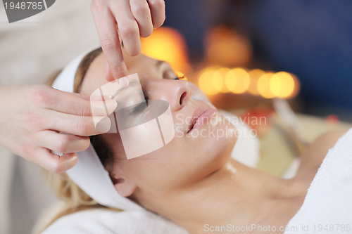 Image of Beautiful young woman in spa