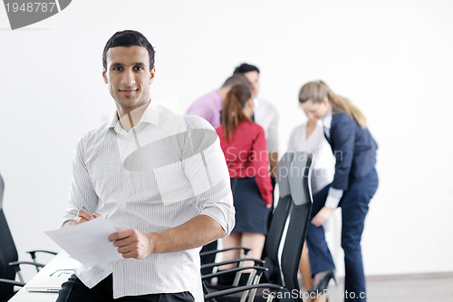 Image of young business man at meeting