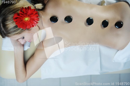 Image of Beautiful young woman in spa