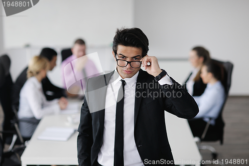 Image of young business man at meeting