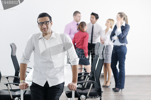 Image of young business man at meeting